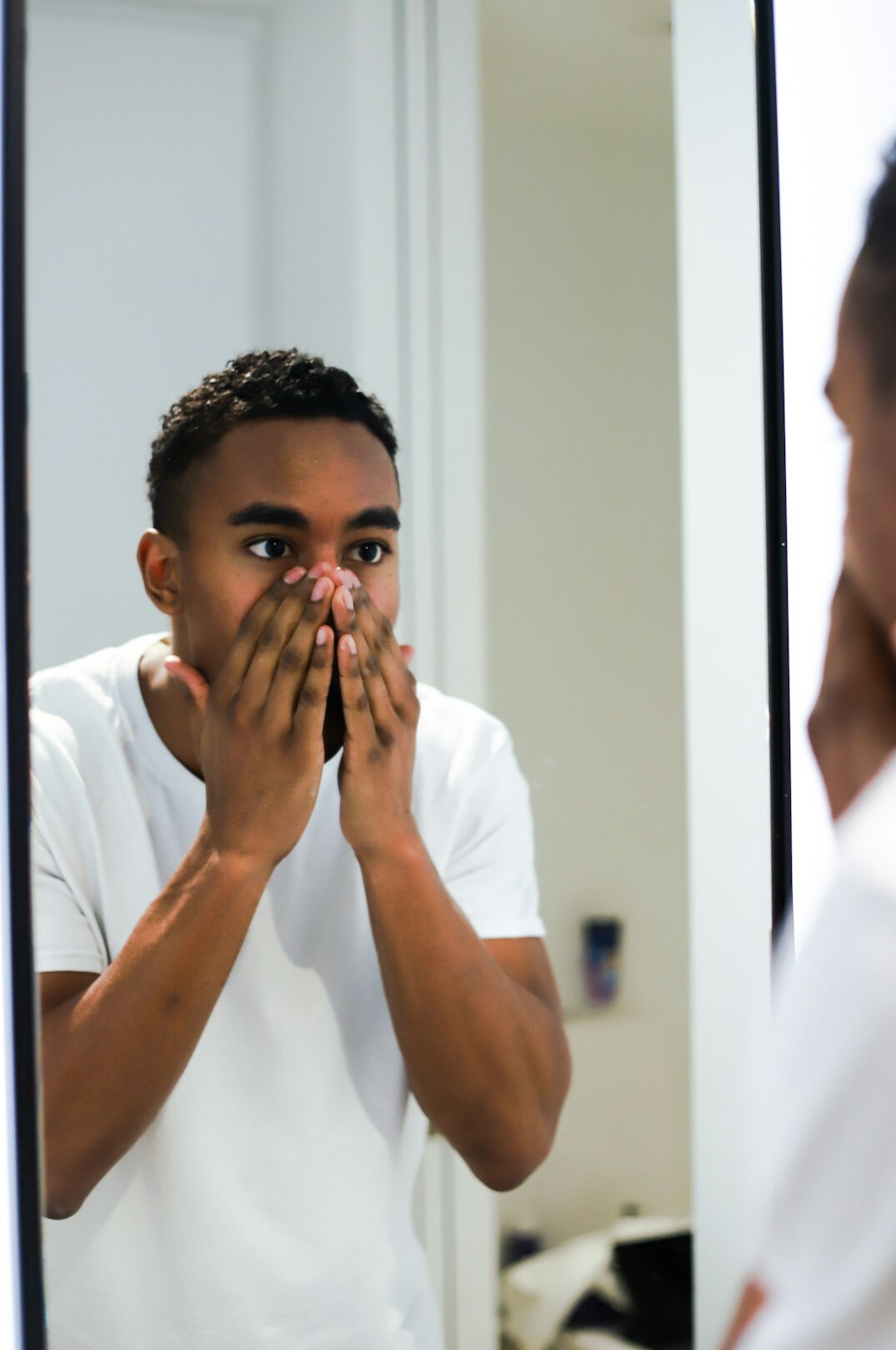man practicing speech in mirror